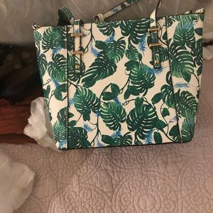 Leaf shoes heels and purse .